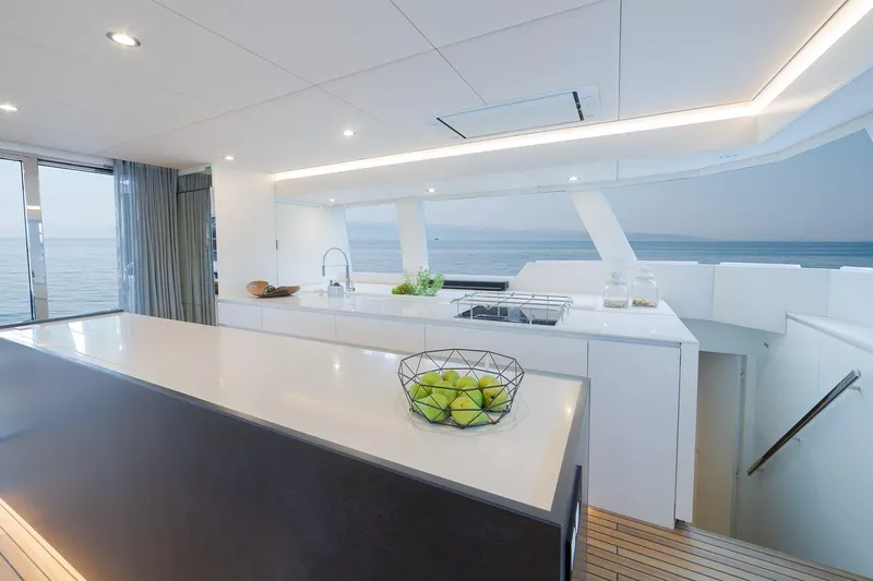  Yacht Photos Pics Luxurious Sunreef 60 yacht kitchen with modern design and ocean view, 2026 model.