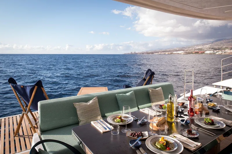  Yacht Photos Pics Luxurious dining setup on Sunreef 60 yacht, 2026, overlooking the ocean.