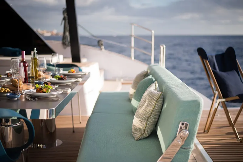  Yacht Photos Pics Luxurious dining setup on Sunreef 60 yacht, 2026 model, with ocean view.