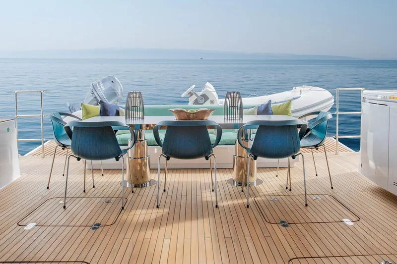  Yacht Photos Pics Luxurious Sunreef 60 yacht deck with elegant seating, dining area, and ocean view, 2026 model.