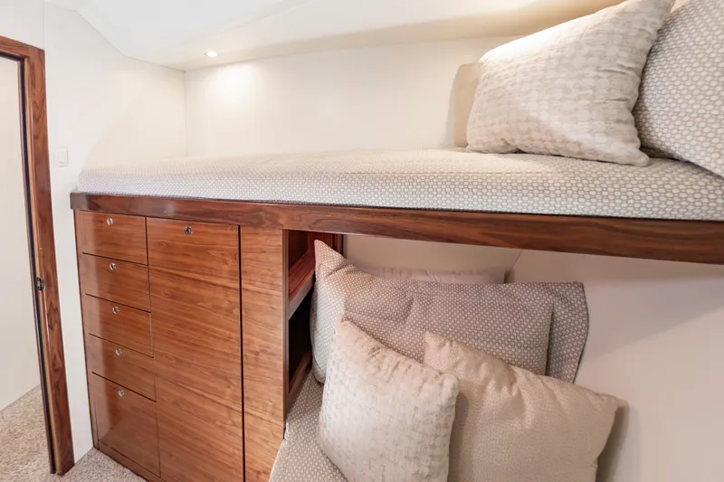 Big Hunter Yacht Photos Pics Interior of 2024 Albemarle Spencer Edition with wooden cabinets and bed.