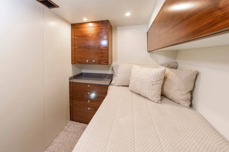 Big Hunter Yacht Photos Pics Interior of 2024 Albemarle Spencer Edition with bed and wooden cabinets.