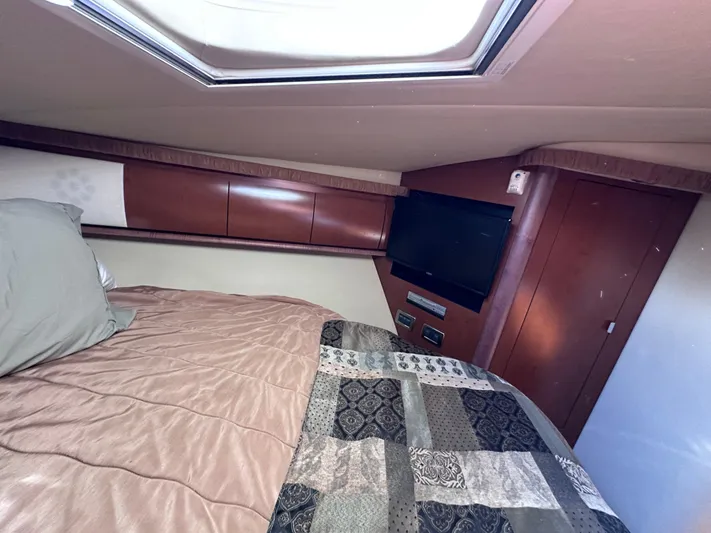 Crash Money Yacht Photos Pics Interior cabin of 2007 Sea Ray 44 Sundancer with bed and TV.