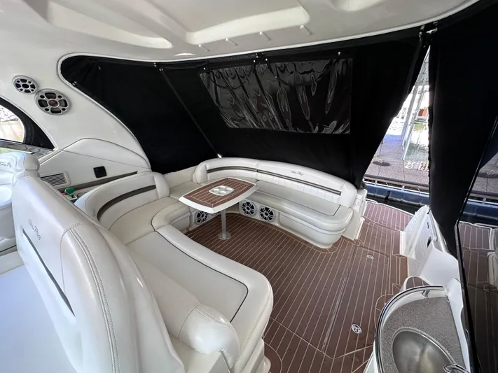 Crash Money Yacht Photos Pics Luxurious interior of 2007 Sea Ray 44 Sundancer yacht with elegant seating and table.