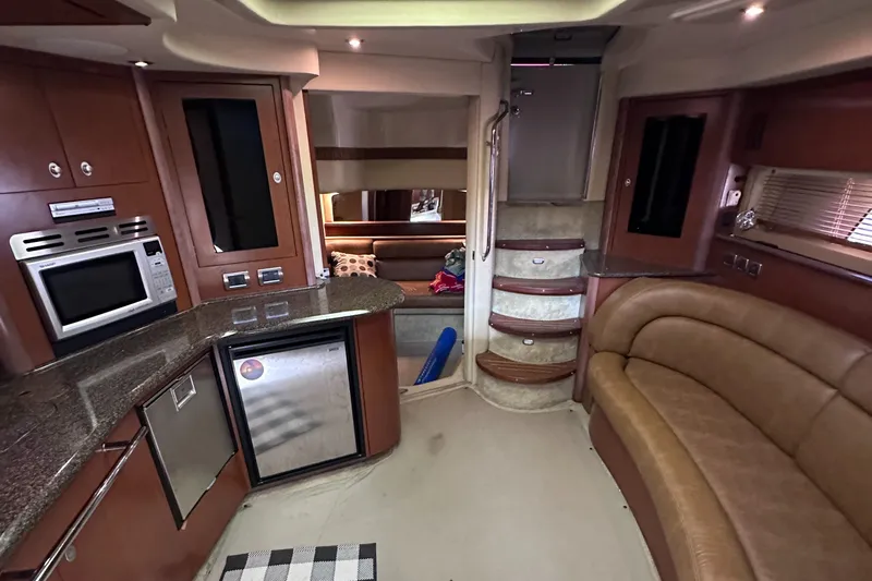 Crash Money Yacht Photos Pics Interior of 2007 Sea Ray 44 Sundancer yacht with modern kitchen and seating area.