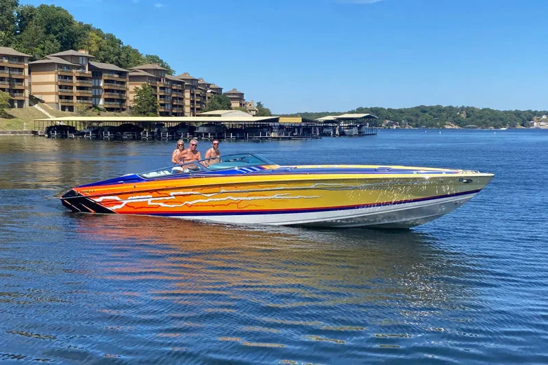  Yacht Photos Pics 2008 Formula 382 FASTech speedboat on a lake, vibrant design, with people enjoying the ride.
