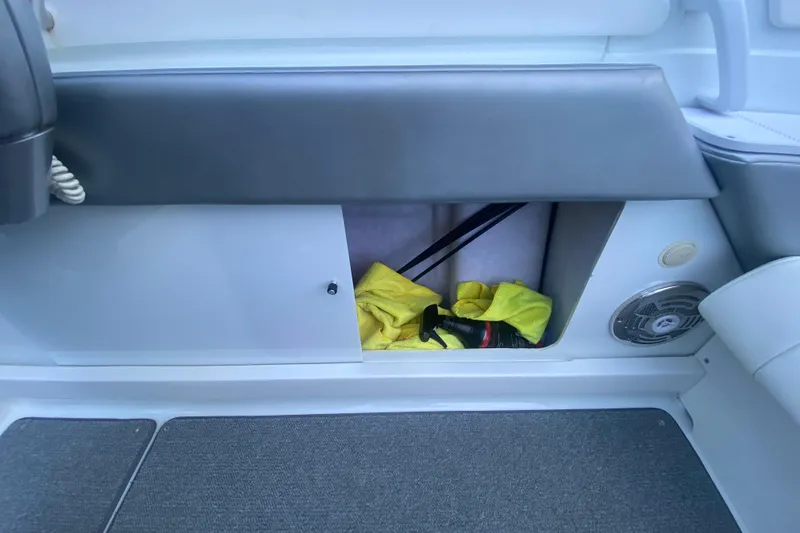  Yacht Photos Pics Storage compartment in 2008 Formula 382 FASTech boat with cleaning supplies and speaker.