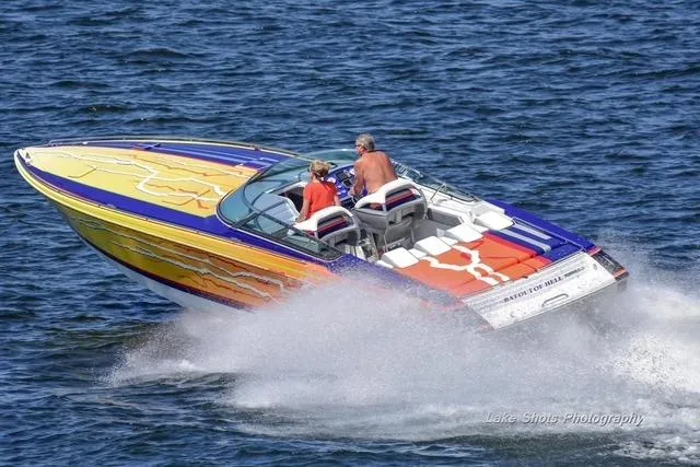  Yacht Photos Pics 2008 Formula 382 FASTech speedboat with vibrant design cruising on open water.