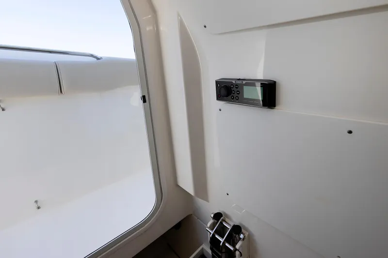 Murphy's Law Yacht Photos Pics Interior view of a 2016 Boston Whaler 330 Outrage boat, featuring a mounted control panel.