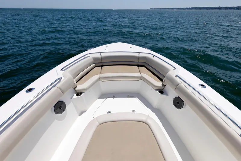 Murphy's Law Yacht Photos Pics Boston Whaler 330 Outrage 2016 boat bow with cushioned seating on open water.