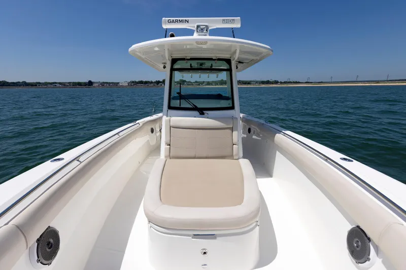 Murphy's Law Yacht Photos Pics 2016 Boston Whaler 330 Outrage boat on water, featuring spacious seating and Garmin equipment.