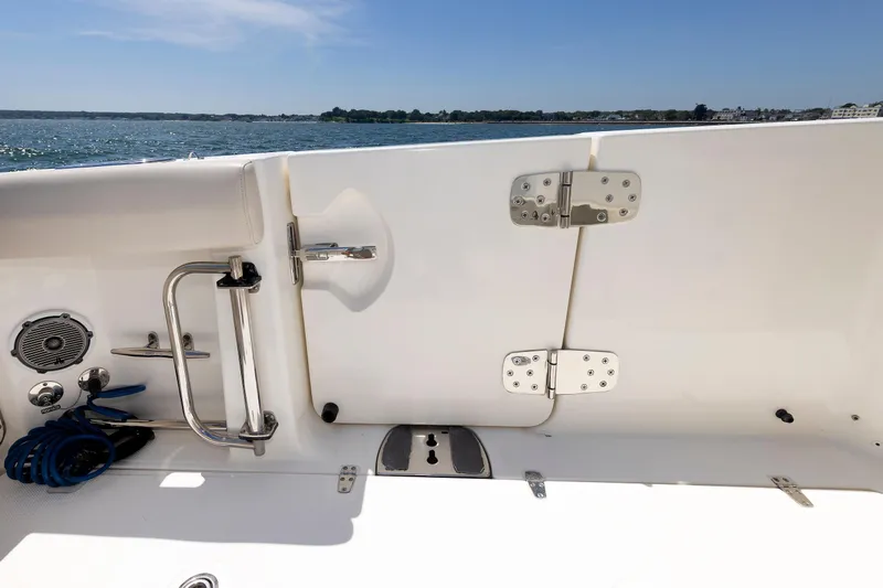 Murphy's Law Yacht Photos Pics 2016 Boston Whaler 330 Outrage boat deck with ocean view, featuring stainless steel fittings.