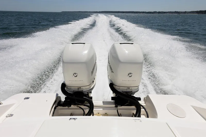 Murphy's Law Yacht Photos Pics Boston Whaler 330 Outrage 2016 with dual outboard engines cruising on open water.