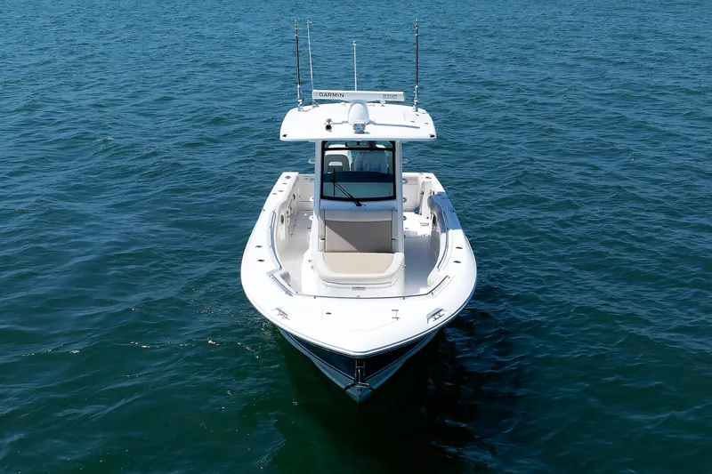 Murphy's Law Yacht Photos Pics 2016 Boston Whaler 330 Outrage boat on open water, aerial view.