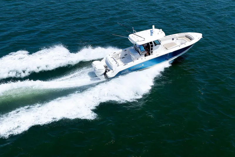 Murphy's Law Yacht Photos Pics Boston Whaler 330 Outrage 2016 cruising swiftly on open water.