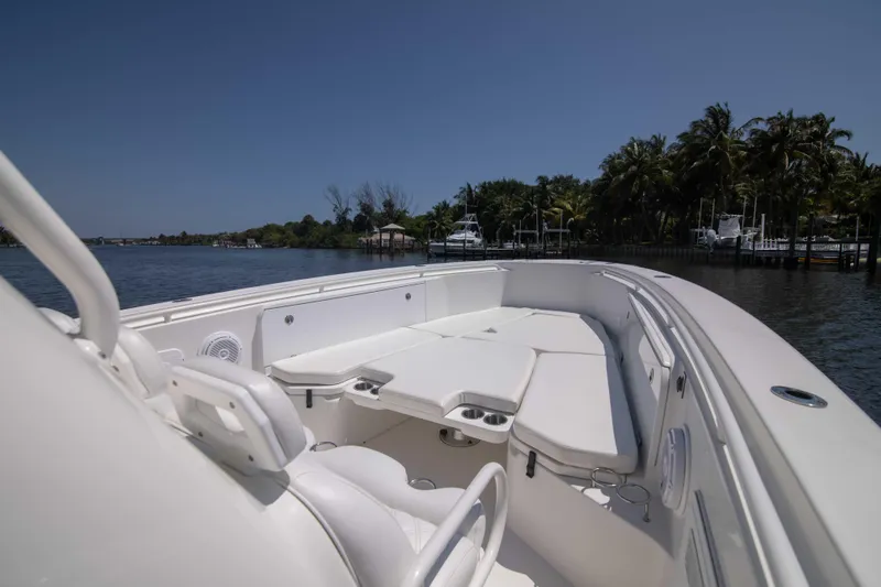 Outta Hand Yacht Photos Pics 2009 Everglades 350CC boat on calm water, featuring spacious deck and seating.