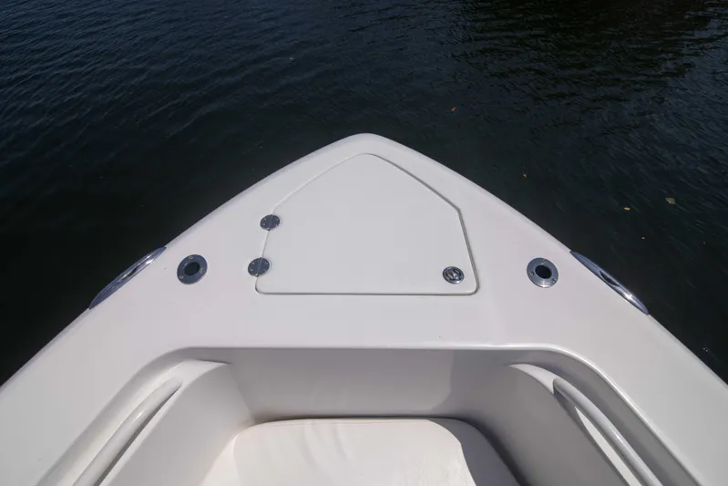 Outta Hand Yacht Photos Pics Bow of 2009 Everglades 350CC boat on calm water.