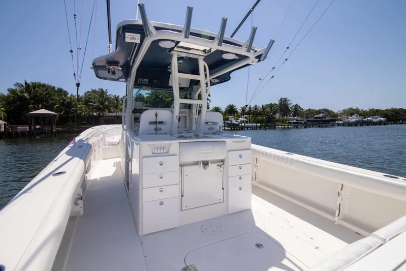 Outta Hand Yacht Photos Pics 2009 Everglades 350CC boat on calm water, featuring spacious deck and modern design.