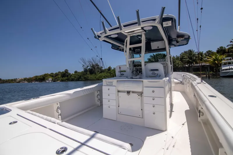 Outta Hand Yacht Photos Pics 2009 Everglades 350CC boat with center console, docked on a sunny day.