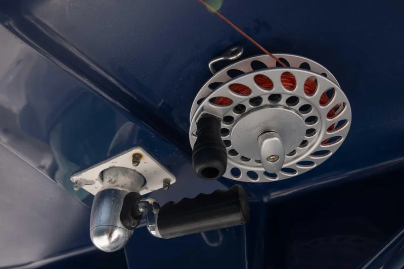 Outta Hand Yacht Photos Pics Close-up of a fishing reel on a 2009 Everglades 350CC boat.