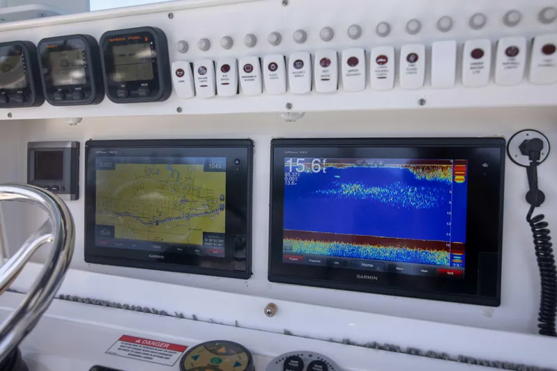 Outta Hand Yacht Photos Pics Everglades 350CC 2009 boat dashboard with navigation and sonar displays.