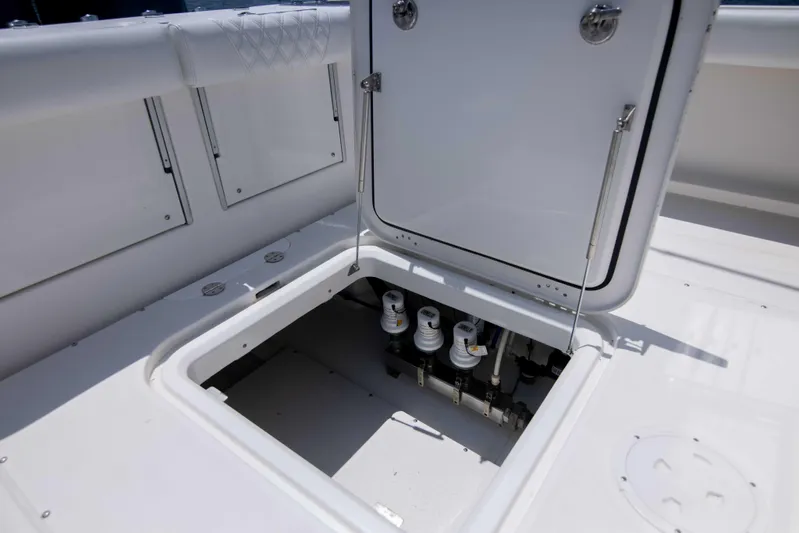 Outta Hand Yacht Photos Pics Open hatch on 2009 Everglades 350CC boat deck showing internal components.
