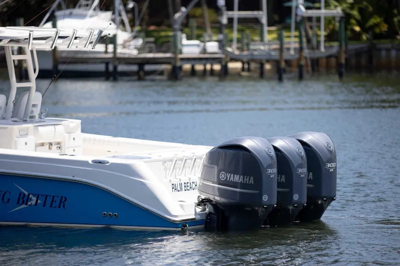 Outta Hand Yacht Photos Pics 2009 Everglades 350CC boat with triple Yamaha 300 engines docked in marina.