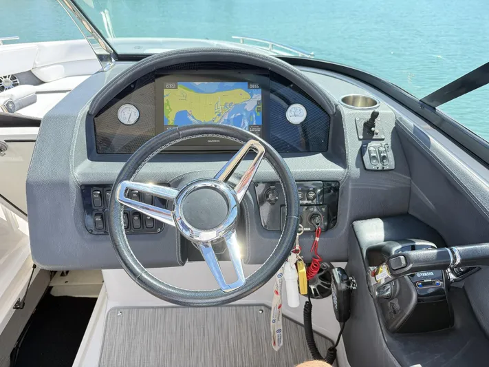  Yacht Photos Pics 2019 Regal 29 OBX boat dashboard with steering wheel and navigation display.