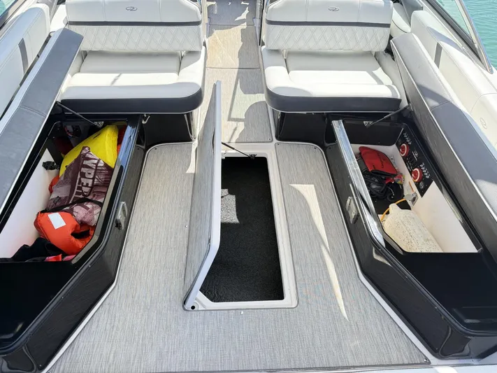  Yacht Photos Pics 2019 Regal 29 OBX boat interior with open storage compartments and seating.