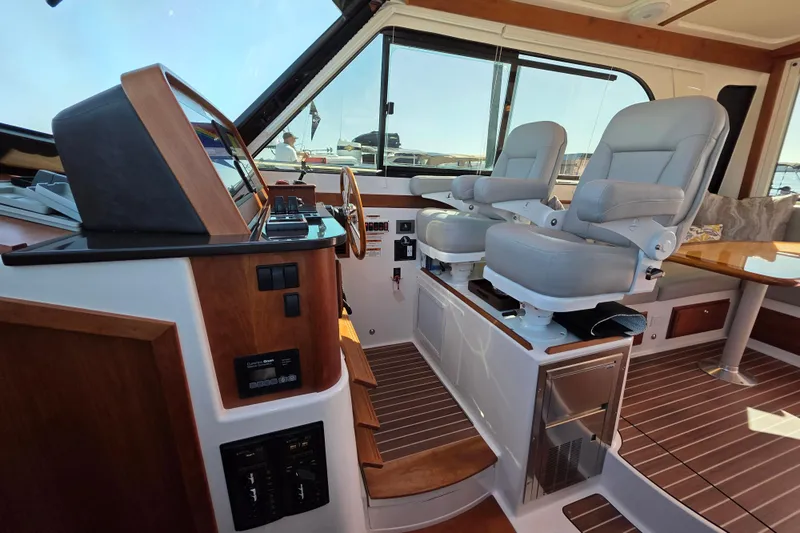  Yacht Photos Pics Interior of 2022 Back Cove 372 yacht with helm station and seating.