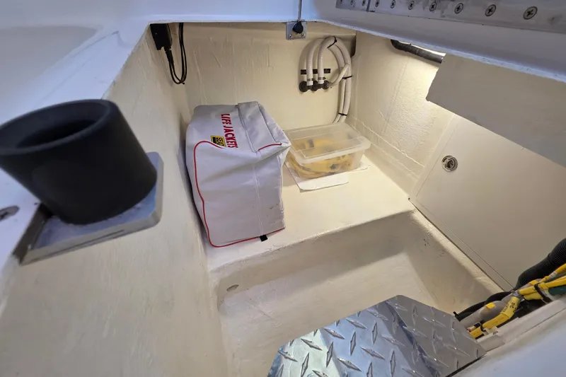  Yacht Photos Pics 2022 Back Cove 372 storage compartment with life jackets and equipment.