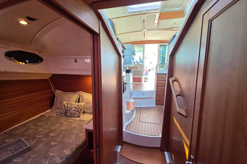  Yacht Photos Pics Luxurious interior of 2022 Back Cove 372 yacht, featuring cozy cabin and elegant wood finishes.