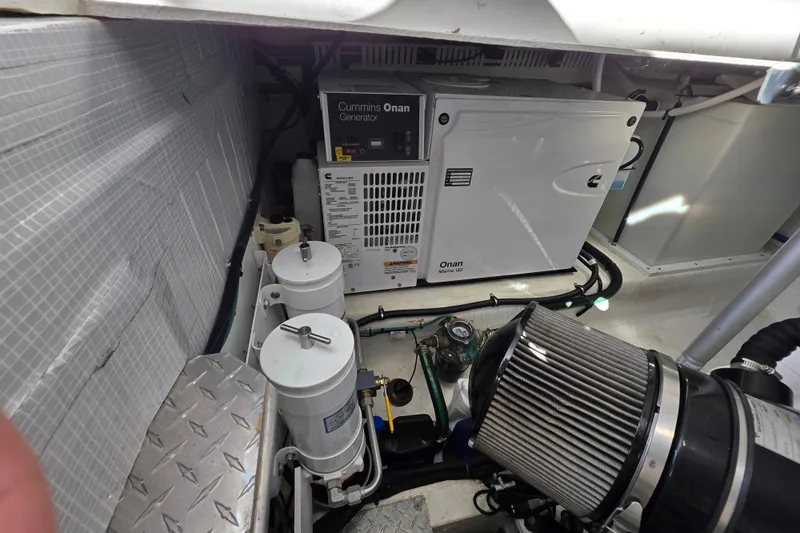  Yacht Photos Pics Engine room of 2022 Back Cove 372 with Cummins Onan generator and filters.