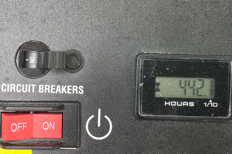  Yacht Photos Pics Control panel of 2022 Back Cove 372 with circuit breakers and hour meter reading 442.1 hours.