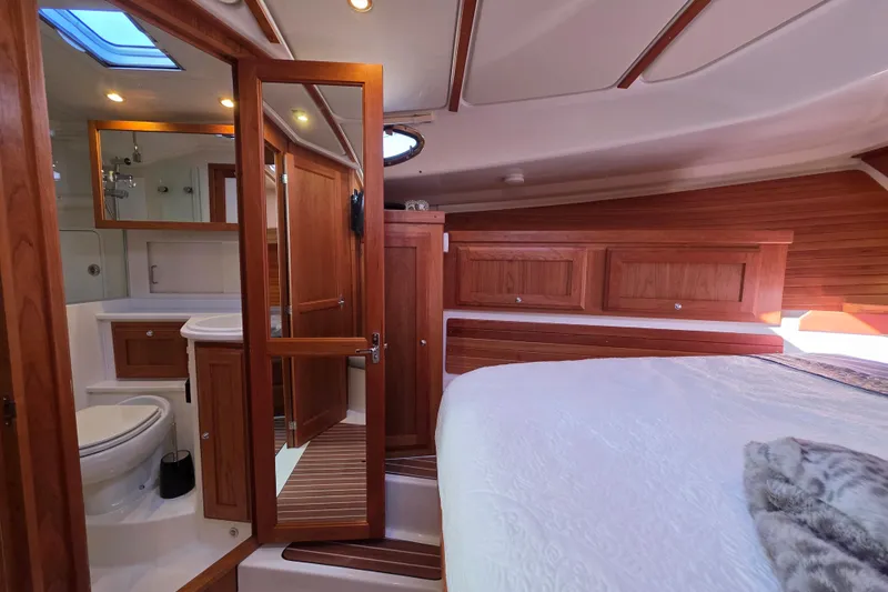  Yacht Photos Pics Luxurious 2022 Back Cove 372 yacht interior with wood finish and modern amenities.