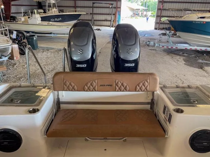  Yacht Photos Pics 2025 Sea Pro 322 Offshore boat with twin Suzuki 350 engines in a storage facility.