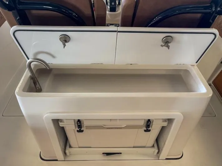  Yacht Photos Pics 2025 Sea Pro 322 Offshore boat interior sink and storage compartment.