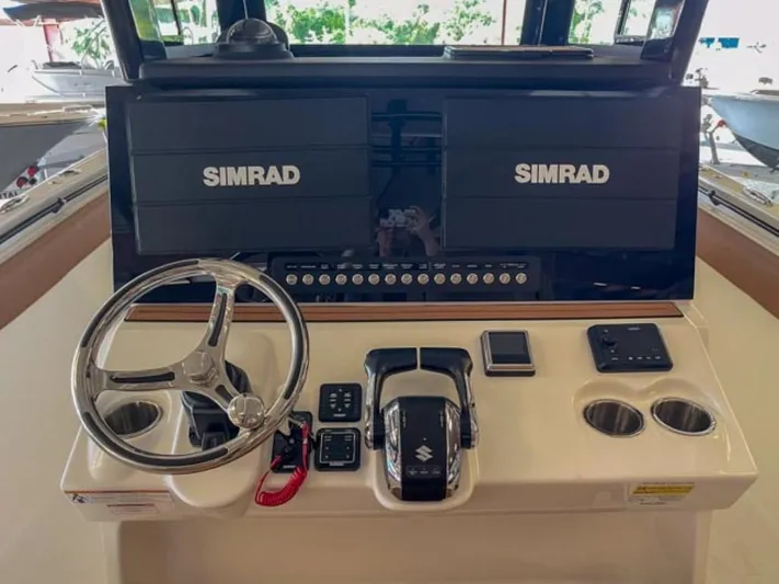  Yacht Photos Pics 2025 Sea Pro 322 Offshore boat helm with dual Simrad displays and Suzuki controls.