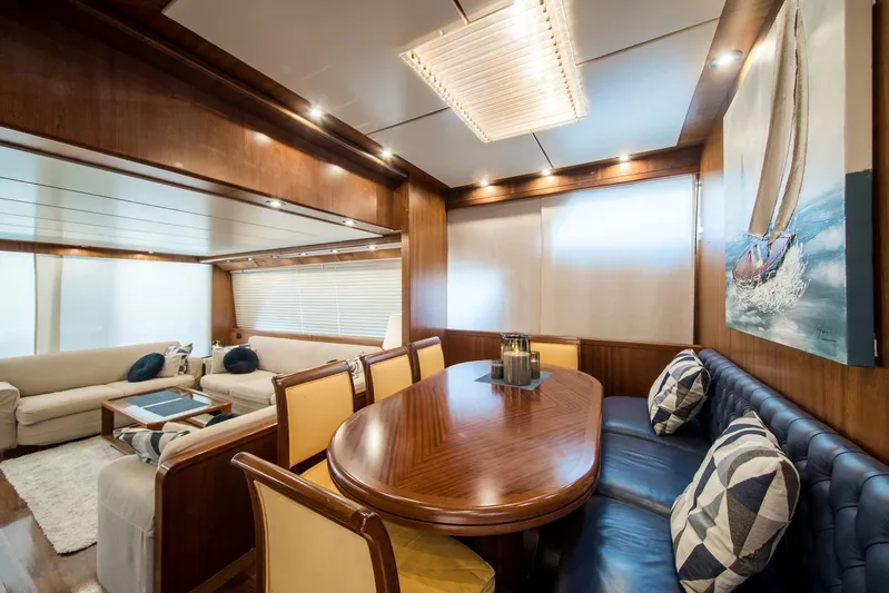  Yacht Photos Pics Luxurious interior of 1998 Sanlorenzo SL72 yacht with elegant dining and seating area.