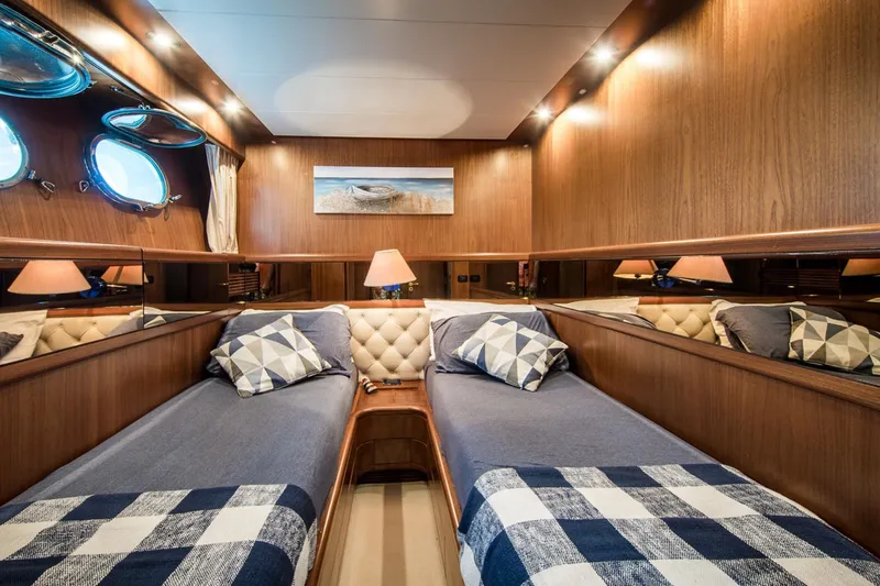  Yacht Photos Pics Luxurious twin cabin interior of 1998 Sanlorenzo SL72 yacht with wood paneling.