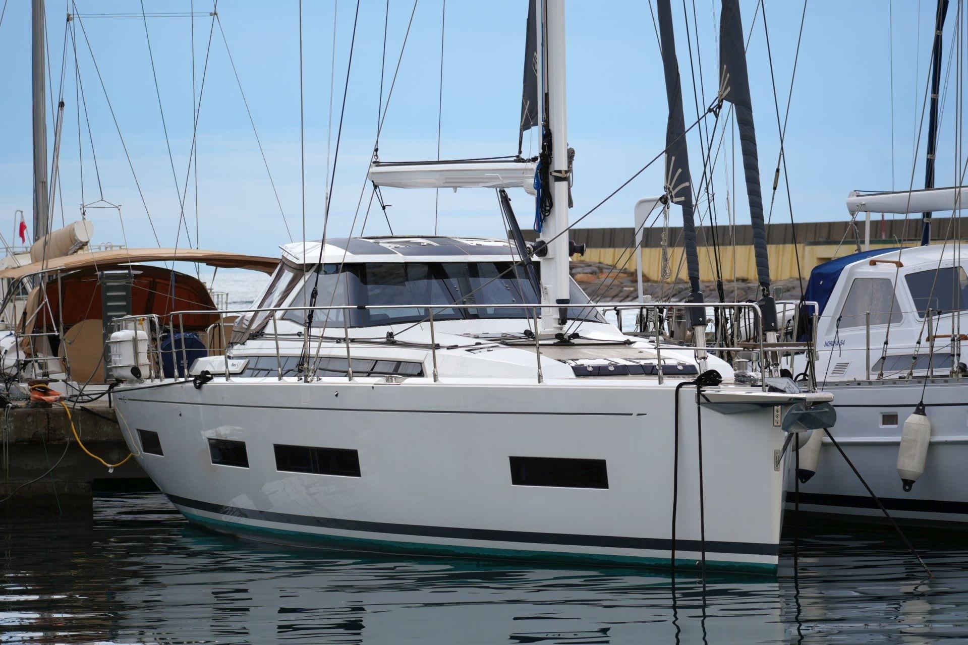 2023 Amel 50 yacht docked in marina, featuring sleek design and modern amenities.