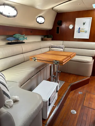  Yacht Photos Pics Interior of 1997 Tiara Yachts 4000 Express with elegant seating and wooden table.