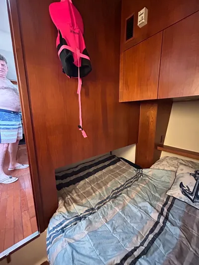  Yacht Photos Pics Interior cabin of 1997 Tiara Yachts 4000 Express with bed and life jacket.