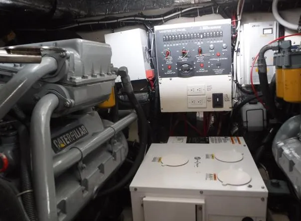  Yacht Photos Pics Engine room of 1997 Tiara Yachts 4000 Express, featuring Caterpillar engine and control panel.