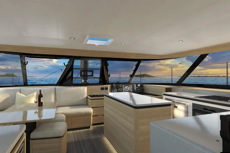 Hh52 New Sc Aft Yacht Photos Pics Luxurious interior of 2026 HH Catamarans HH52 with ocean view, modern kitchen, and seating area.