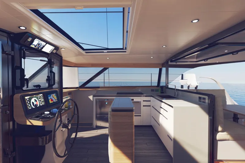 Hh52 New Sc Aft Yacht Photos Pics Luxurious interior of 2026 HH Catamarans HH52 with modern helm and kitchen area.