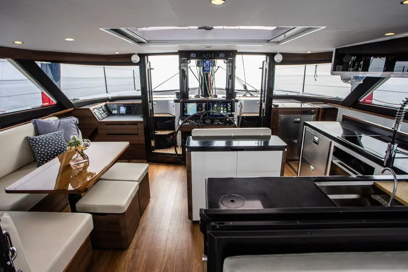 Hh52 New Sc Aft Yacht Photos Pics Luxurious interior of 2026 HH Catamarans HH52, featuring modern kitchen and seating area.
