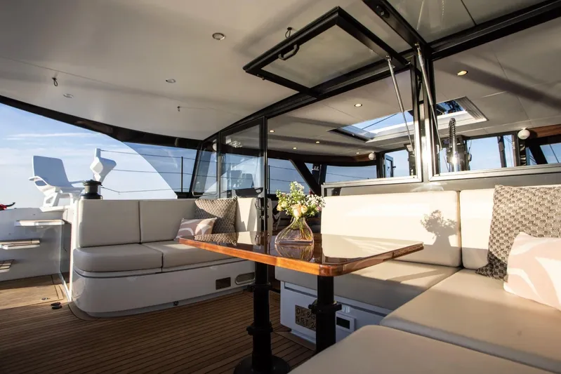 Hh52 New Sc Aft Yacht Photos Pics Luxurious interior of 2026 HH Catamarans HH52 with elegant seating and wooden table.