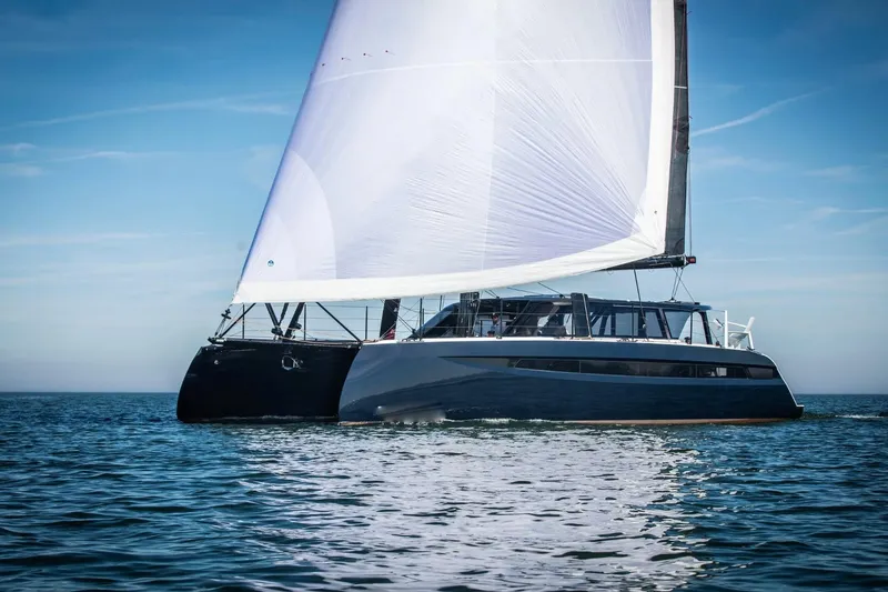 Hh52 New Sc Aft Yacht Photos Pics 2026 HH Catamarans HH52 sailing on open water under clear blue skies.