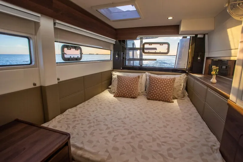 Hh52 New Sc Aft Yacht Photos Pics Luxurious bedroom interior of 2026 HH Catamarans HH52 with ocean view windows.